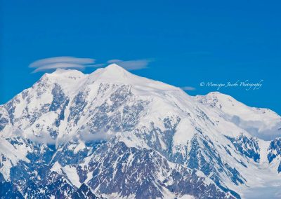 white mountain peaks against blue sky